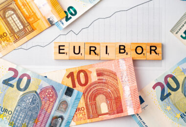 Word EURIBOR Is Written In Wooden Letters On Background Of Euro Banknotes And Chart. Copy paste.